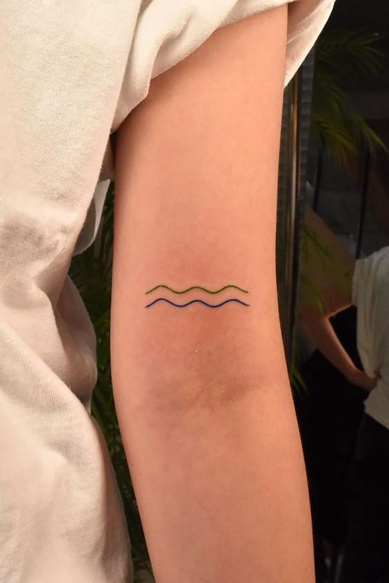 minimalist wave tattoo design